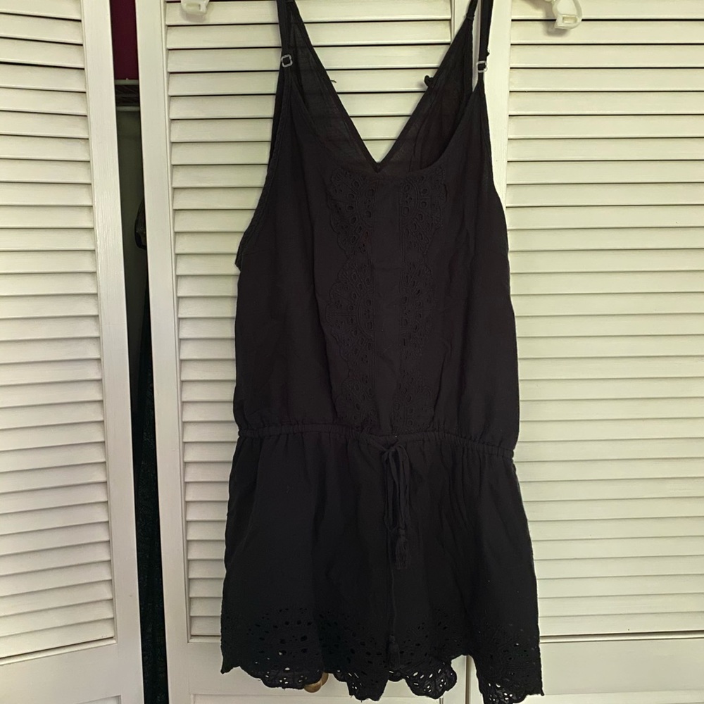 Black romper with eyelet details, size medium